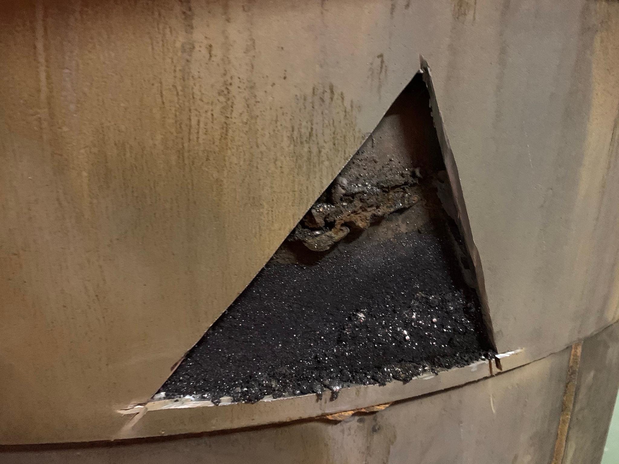 Mercury trapped in steel corrosion void - a hidden pocket of liquid mercury found behind welds in chlor-alkali equipment